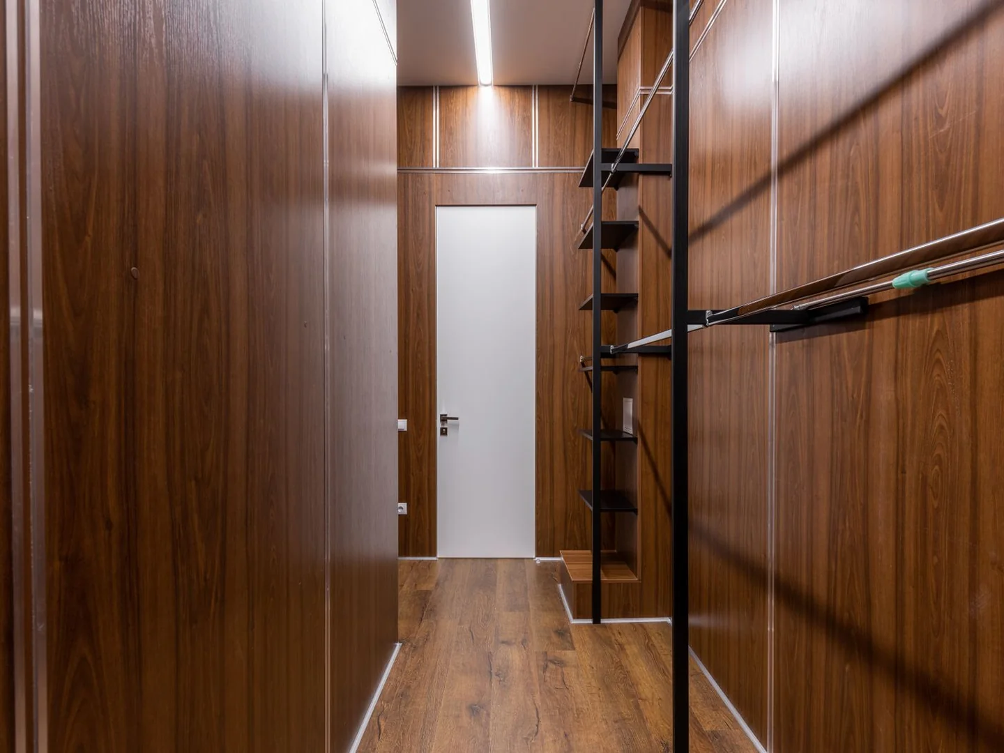 A narrow timber-lined hallway with a clear route through.