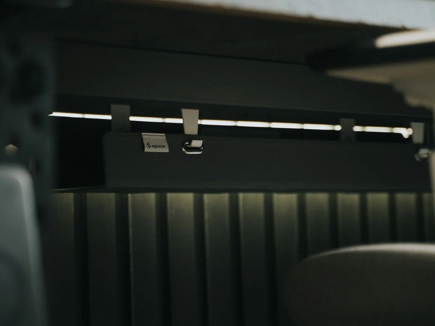 A cable tray fitted beneath a desk.