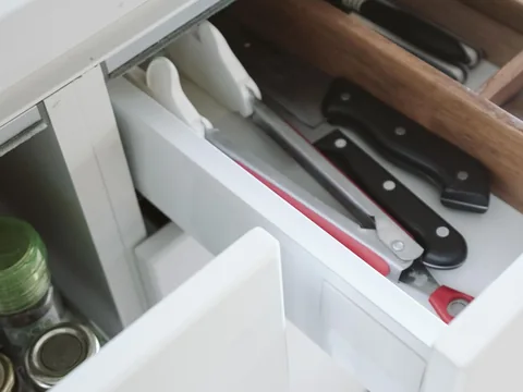 Small compartments dividing the contents of a drawer.